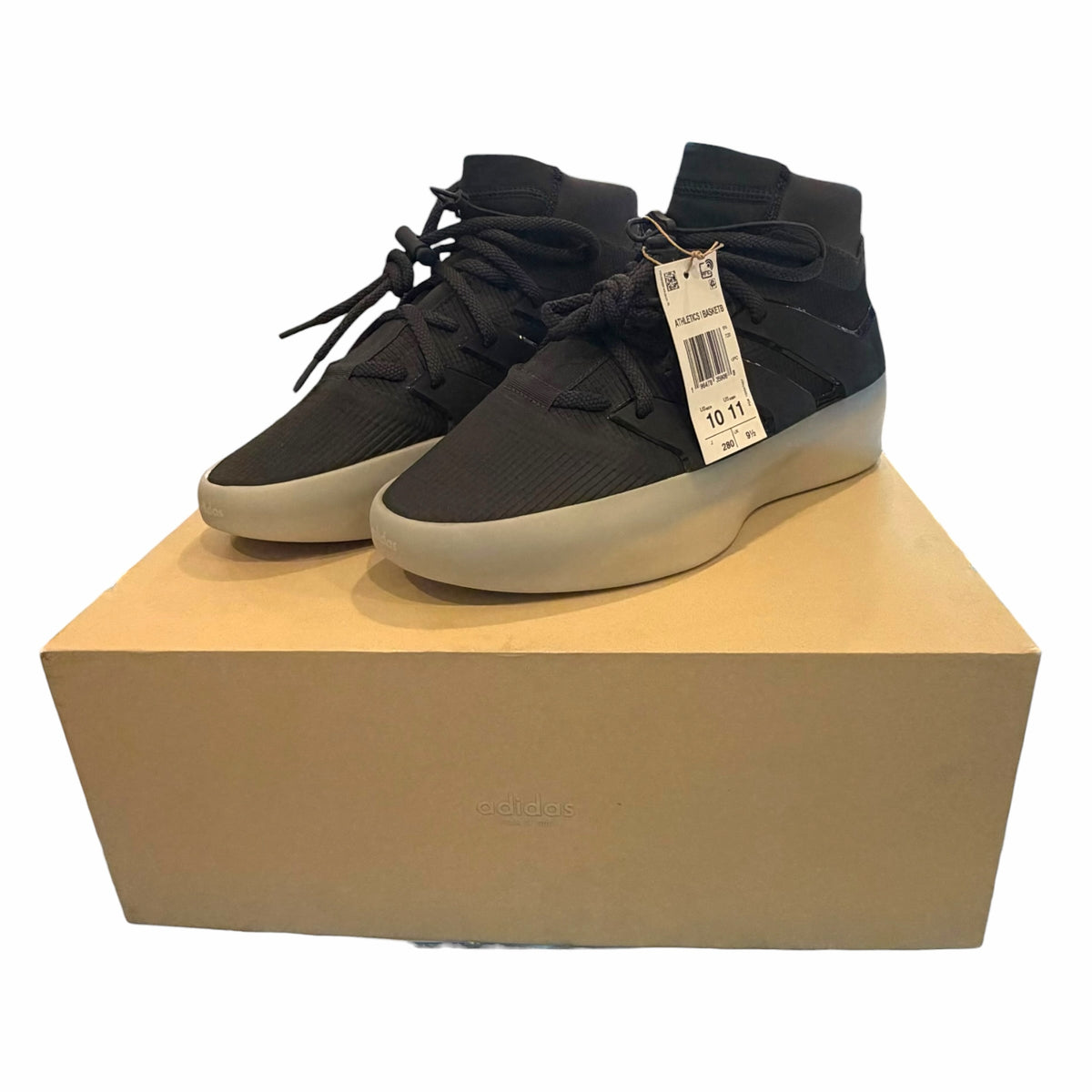 Vangsworld, Inc adidas Fear of God Athletics black high-top basketball sneakers with a neutral midsole on a shoe box
