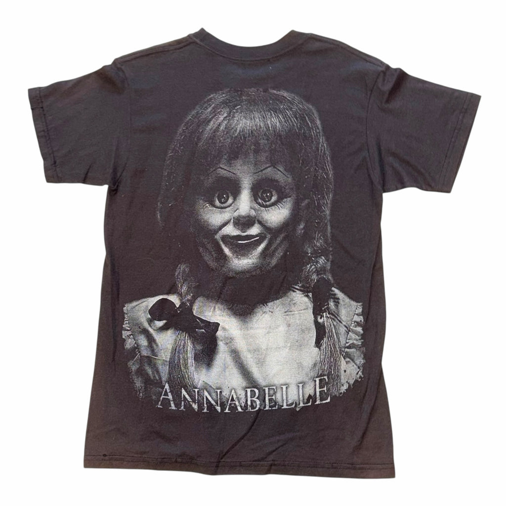 Vangsworld, Inc black cotton t-shirt featuring a detailed Annabelle horror movie doll graphic print on the front.