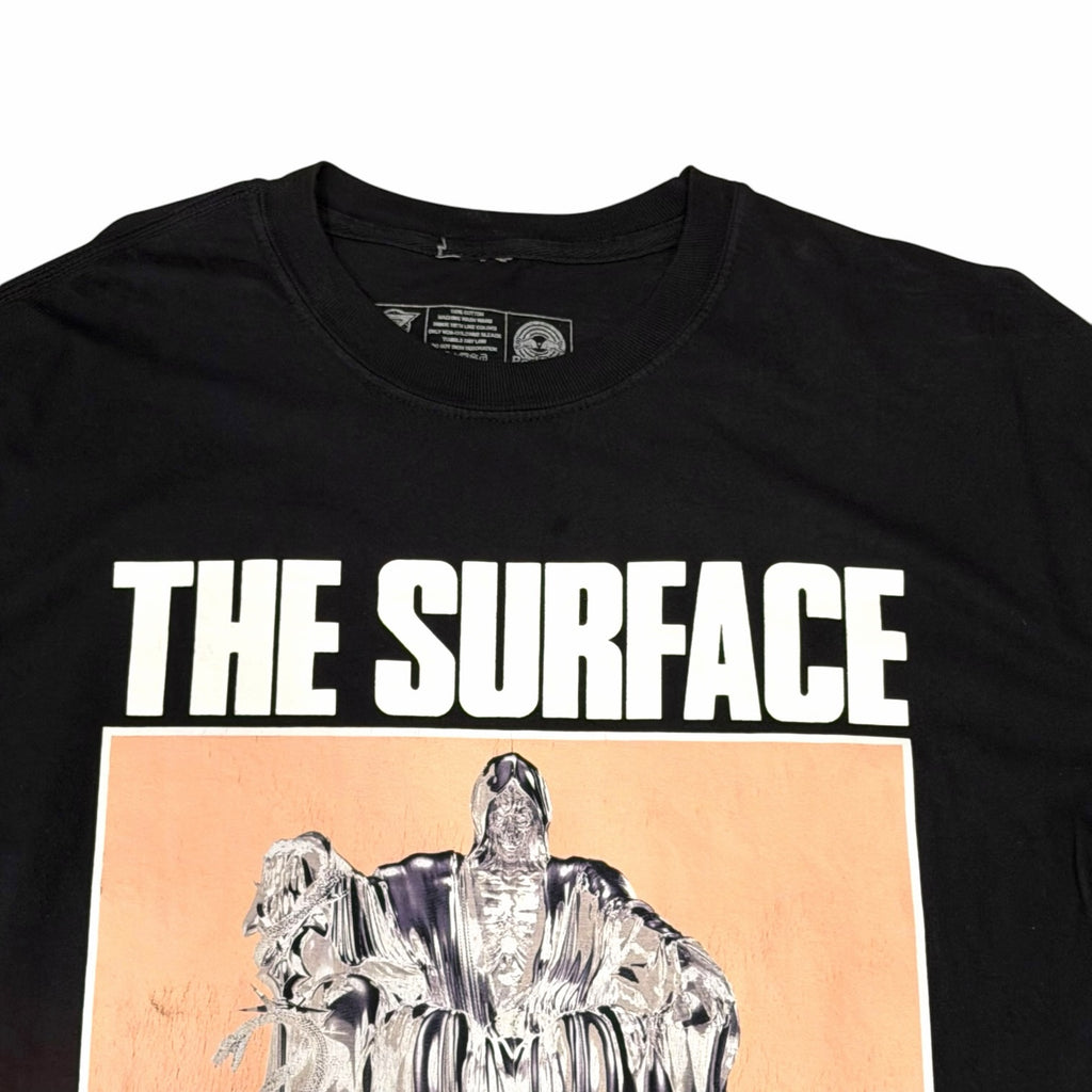 Vangsworld, Inc black cotton crewneck t-shirt featuring The Surface graphic print with bold white lettering