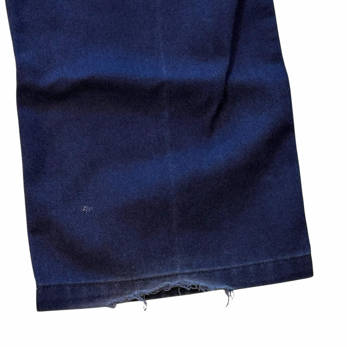 Vangsworld, Inc BEN DAVIS navy blue work pants leg showing durable cotton blend fabric and frayed hem detail