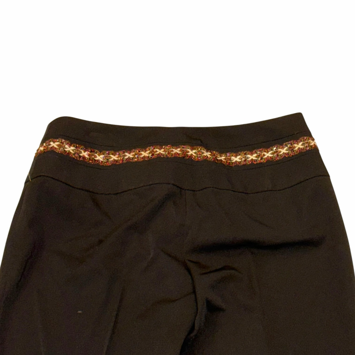 Vangsworld, Inc black dress pants featuring a decorative multi-colored beaded waistband and tailored silhouette.