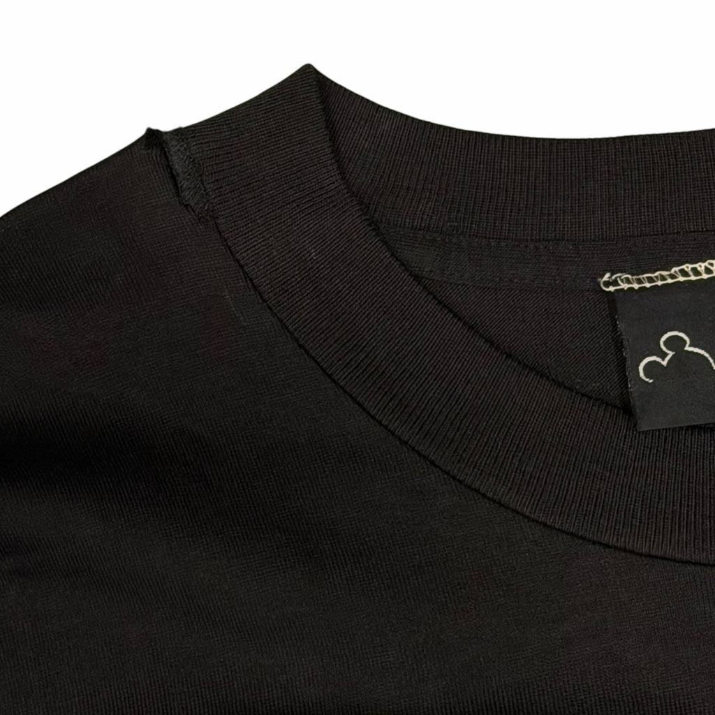 Vangsworld, Inc black cotton crewneck t-shirt with ribbed collar and Disney Originals tag detail