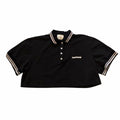 Vangsworld, Inc black cropped polo shirt with white striped collar and cuffs and embroidered logo