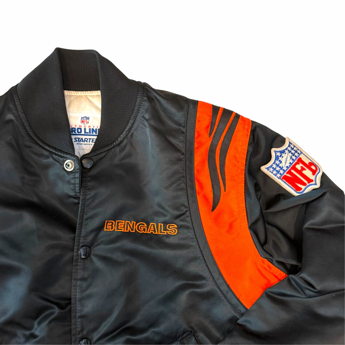 Vangsworld, Inc vintage black and orange Cincinnati Bengals Starter satin bomber jacket with NFL patch and tiger stripes