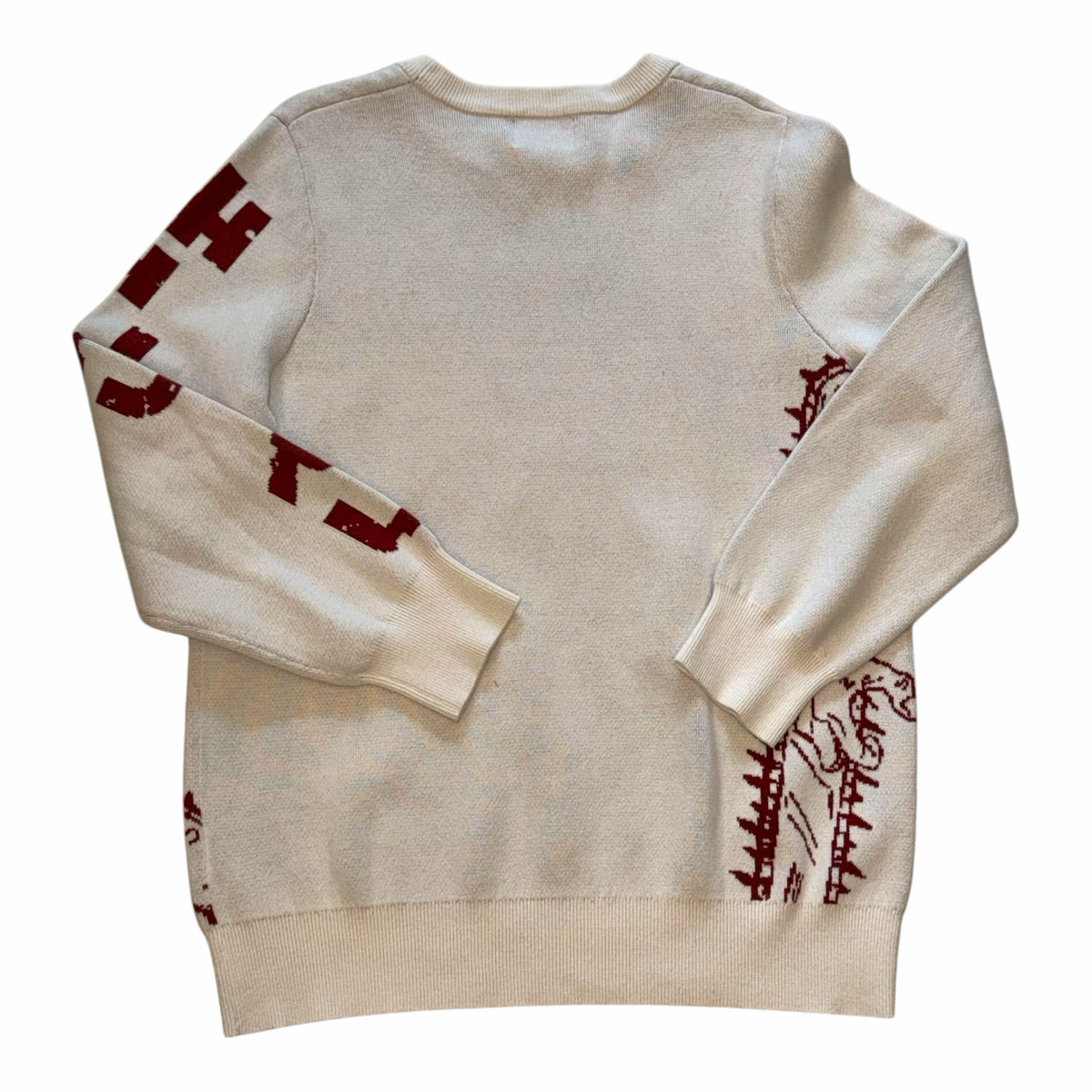 Vangsworld, Inc cream knit crewneck sweater with burgundy anime-inspired graphic on sleeves and back, ribbed trim.