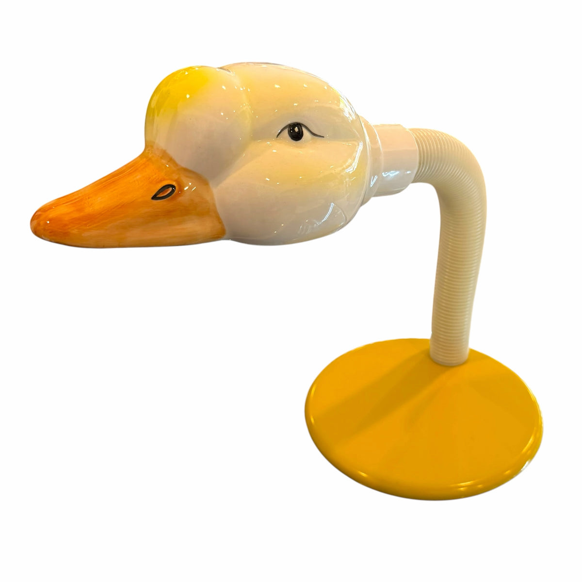 Vangsworld, Inc whimsical duck-shaped ceramic desk lamp with a glossy white head, orange beak, and yellow base.