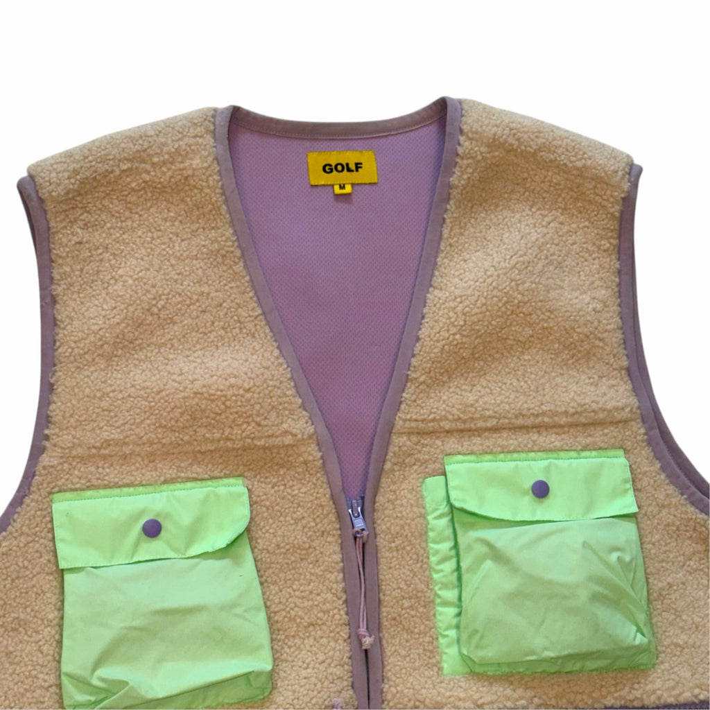 Vangsworld, Inc GOLF fleece utility vest in tan with neon green nylon pockets and lavender trim details.