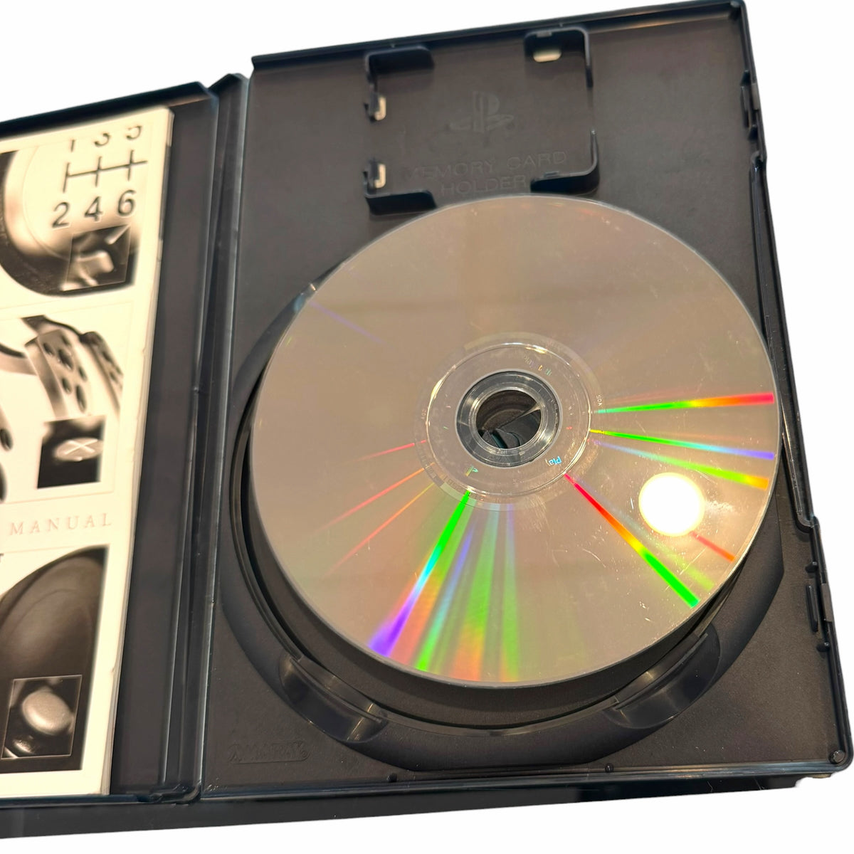 Vangsworld, Inc Gran Turismo 4 PS2 game disc inside its original black plastic case with the instruction manual