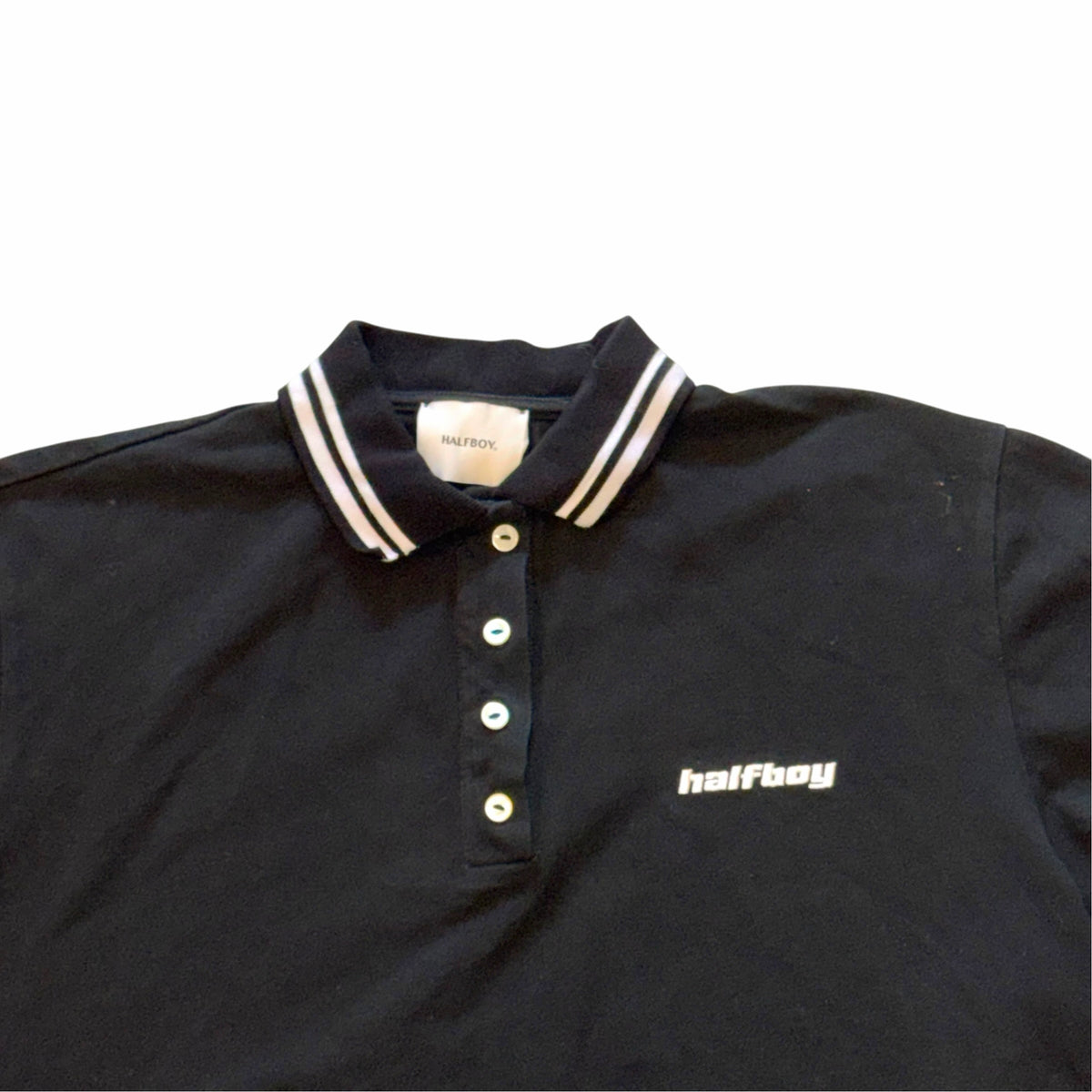 Vangsworld, Inc HALFBOY black cropped polo shirt with white striped collar and button-down placket