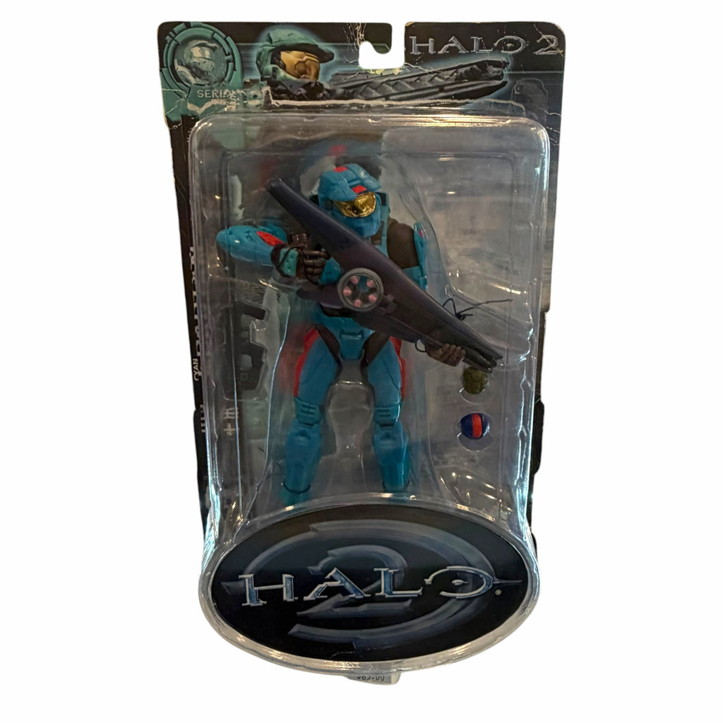 Vangsworld, Inc Halo 2 cyan Spartan action figure in original packaging with a Covenant weapon and gold-tinted visor.