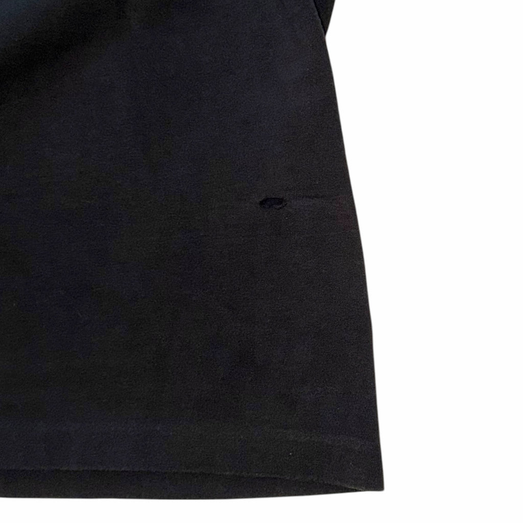 Vangsworld, Inc black cotton Harley-Davidson tank top showing a small, subtle hole on the lower front fabric