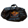 Vangsworld, Inc Harley-Davidson black leather duffel bag with orange piping and eagle logo patch on front pocket