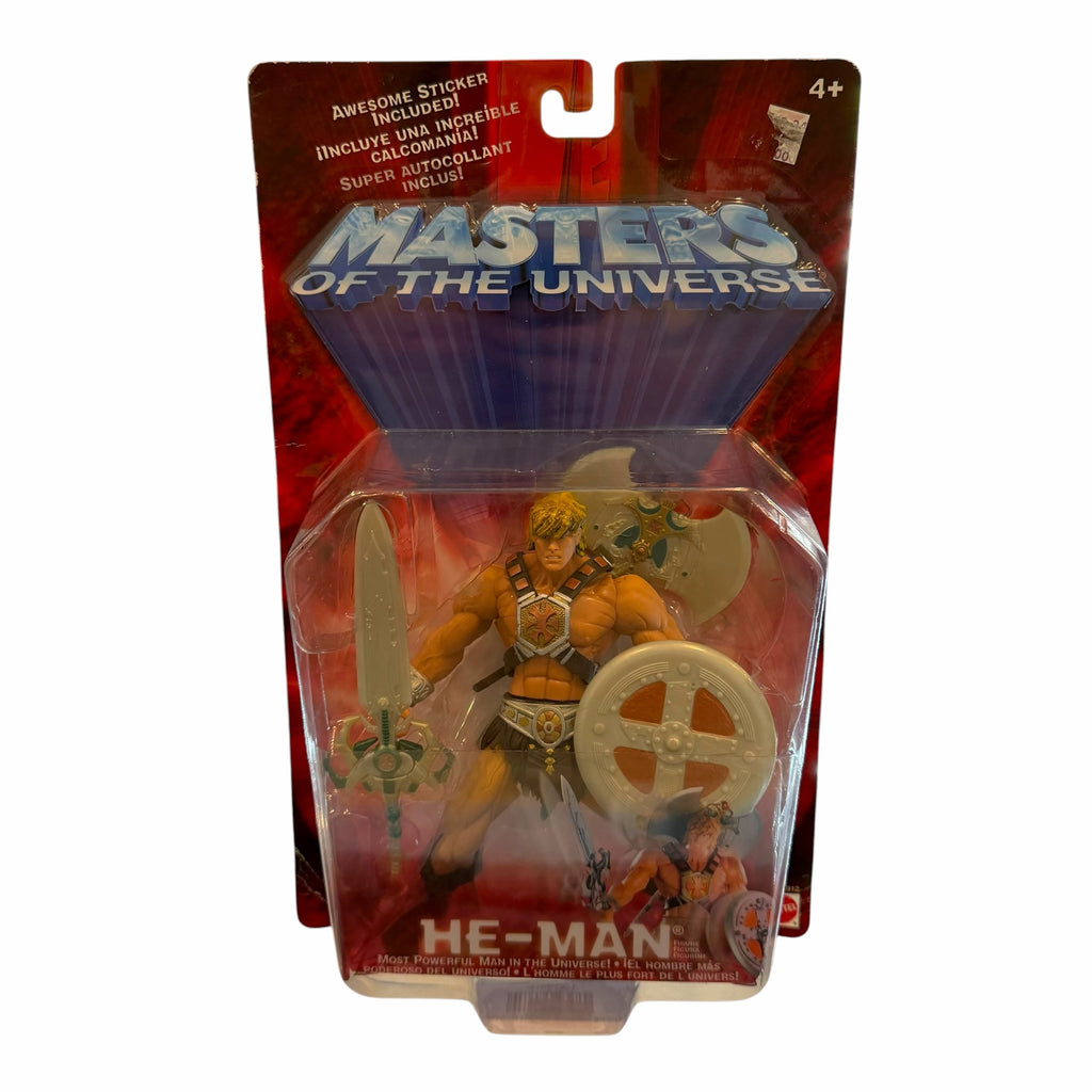 Vangsworld, Inc Masters of the Universe He-Man action figure in original packaging with Power Sword, shield, and axe.