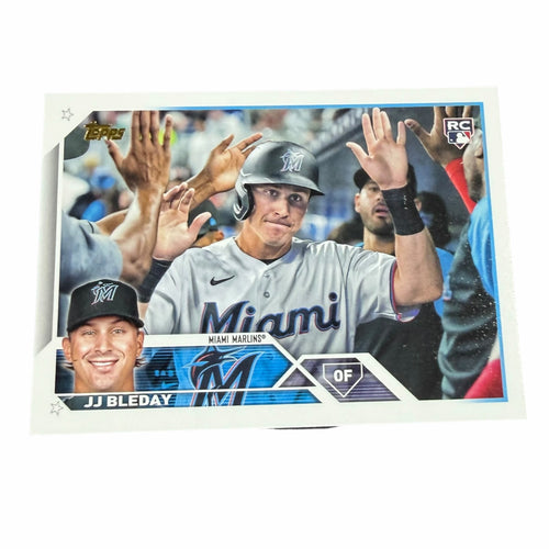 Vangsworld, Inc 2023 Topps JJ Bleday Miami Marlins rookie baseball card featuring a high-five celebration photo