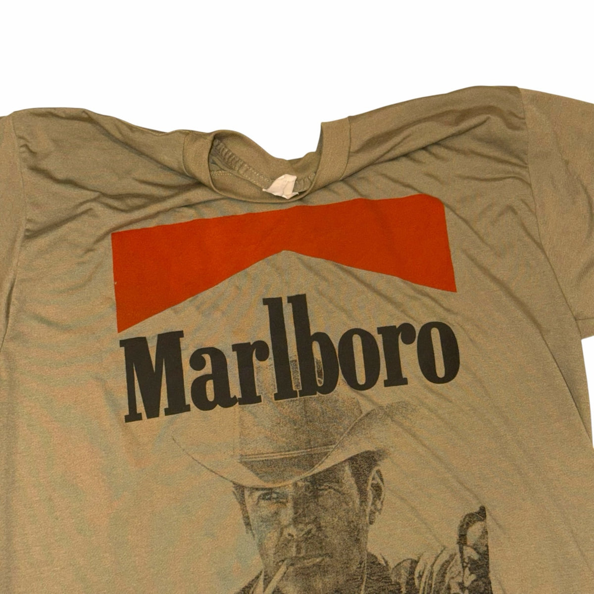 Vangsworld, Inc khaki crewneck t-shirt featuring a vintage Marlboro cowboy graphic print on the chest.