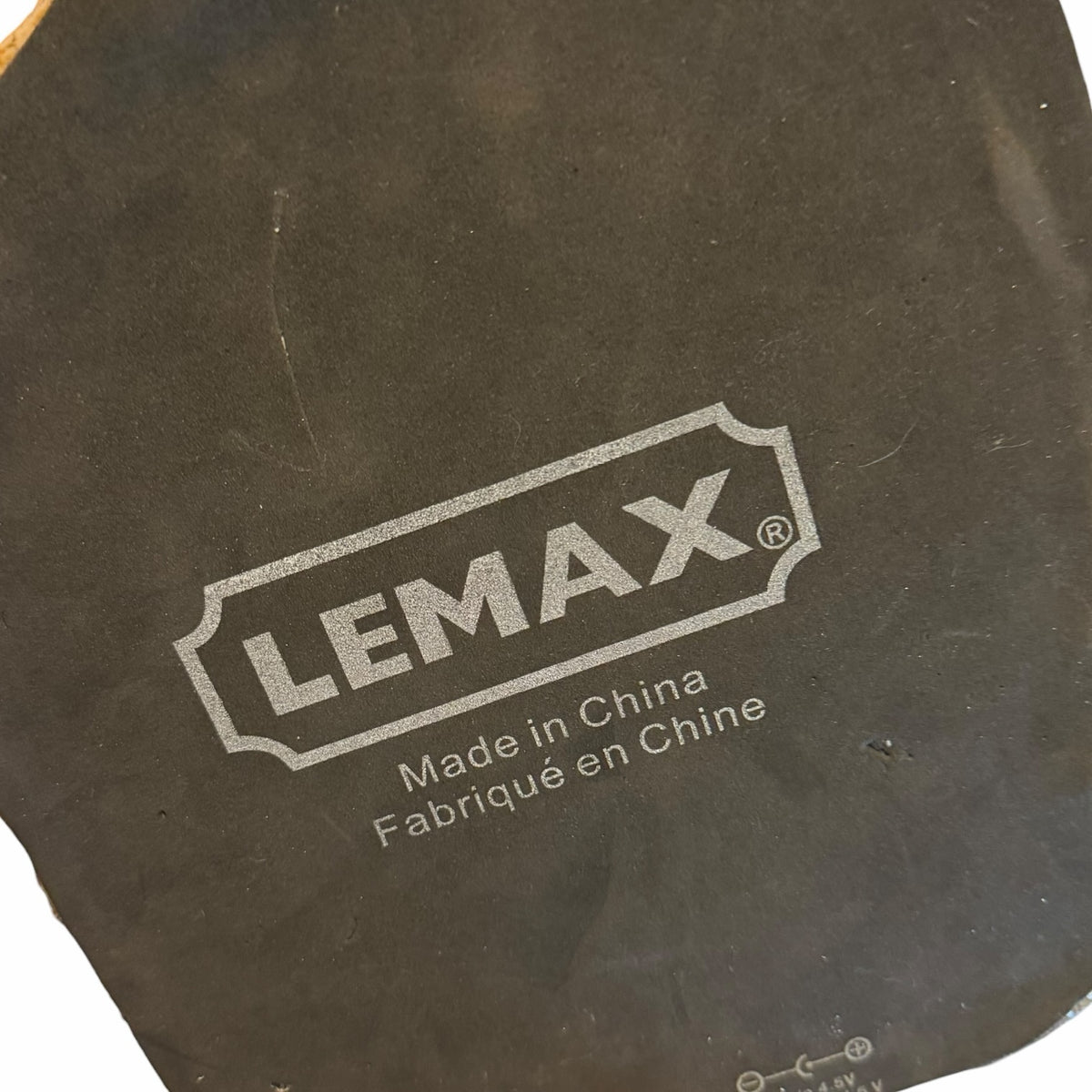 Vangsworld, Inc Lemax Spooky Town brand logo and manufacturing details printed on the base of a collectible figurine