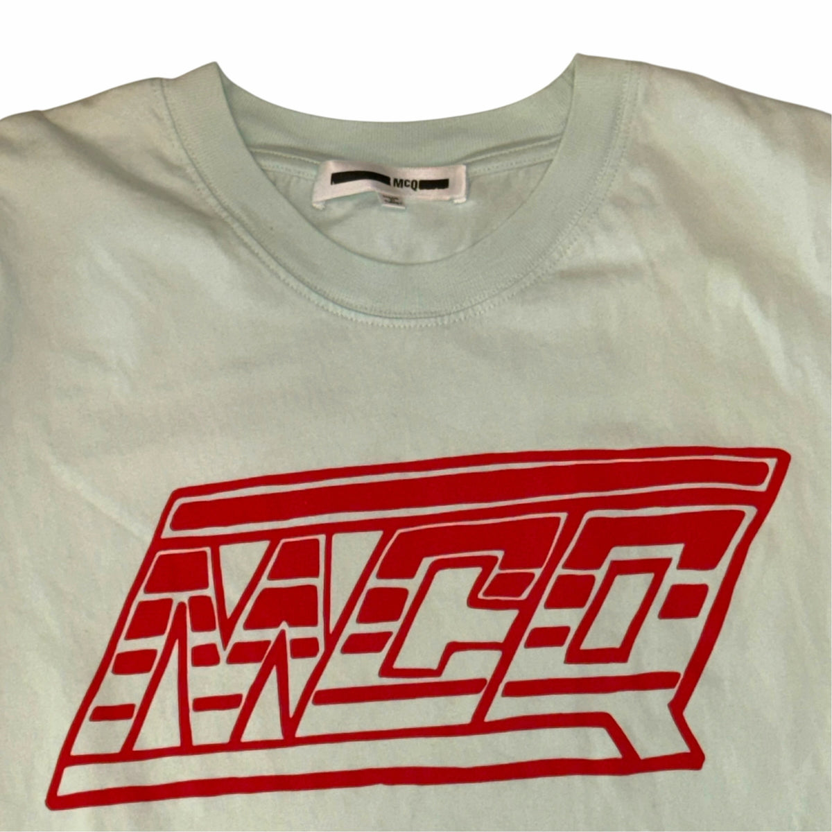 Vangsworld, Inc mint green McQ crewneck t-shirt with a bold red graphic logo print on the chest
