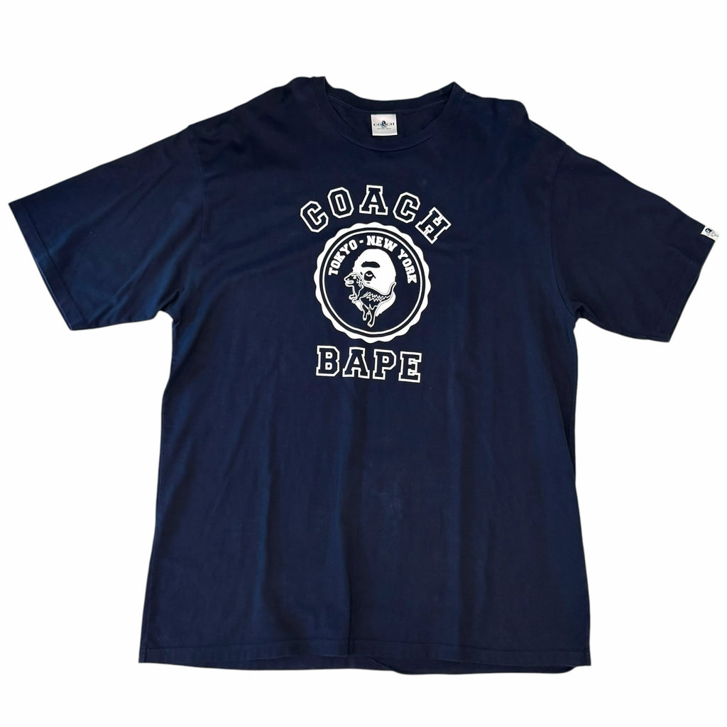 Vangsworld, Inc navy blue A BATHING APE x Coach cotton crewneck t-shirt with white co-branded graphic logo on chest.