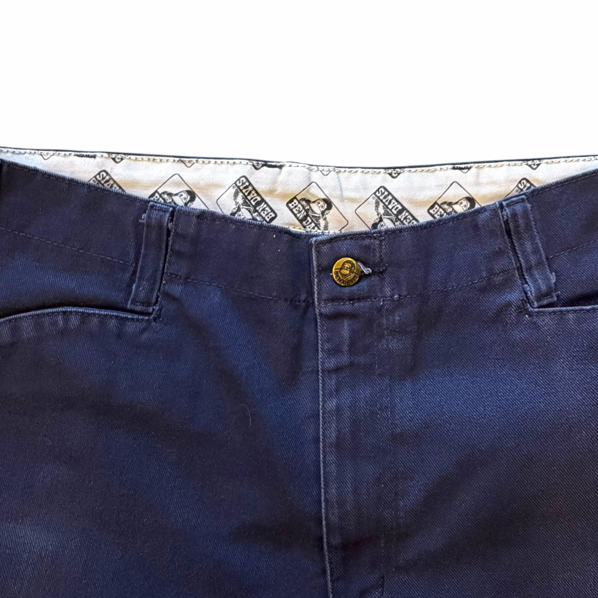 Vangsworld, Inc navy blue Ben Davis work pants featuring a logo-stamped button and branded interior waistband lining.