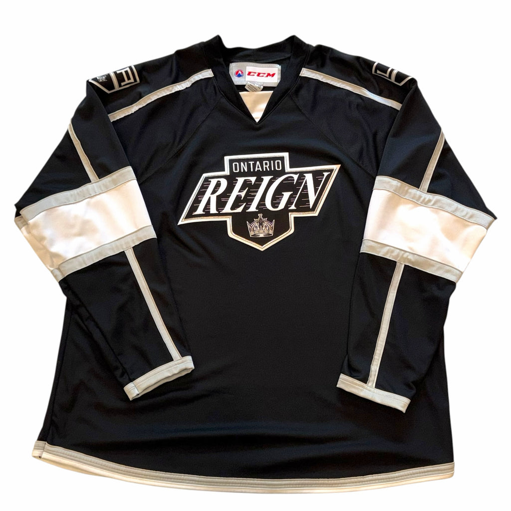 Vangsworld, Inc Ontario Reign professional hockey jersey in black, white, and silver with team crest and CCM branding.