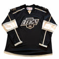 Vangsworld, Inc Ontario Reign professional hockey jersey in black, white, and silver with team crest and CCM branding.