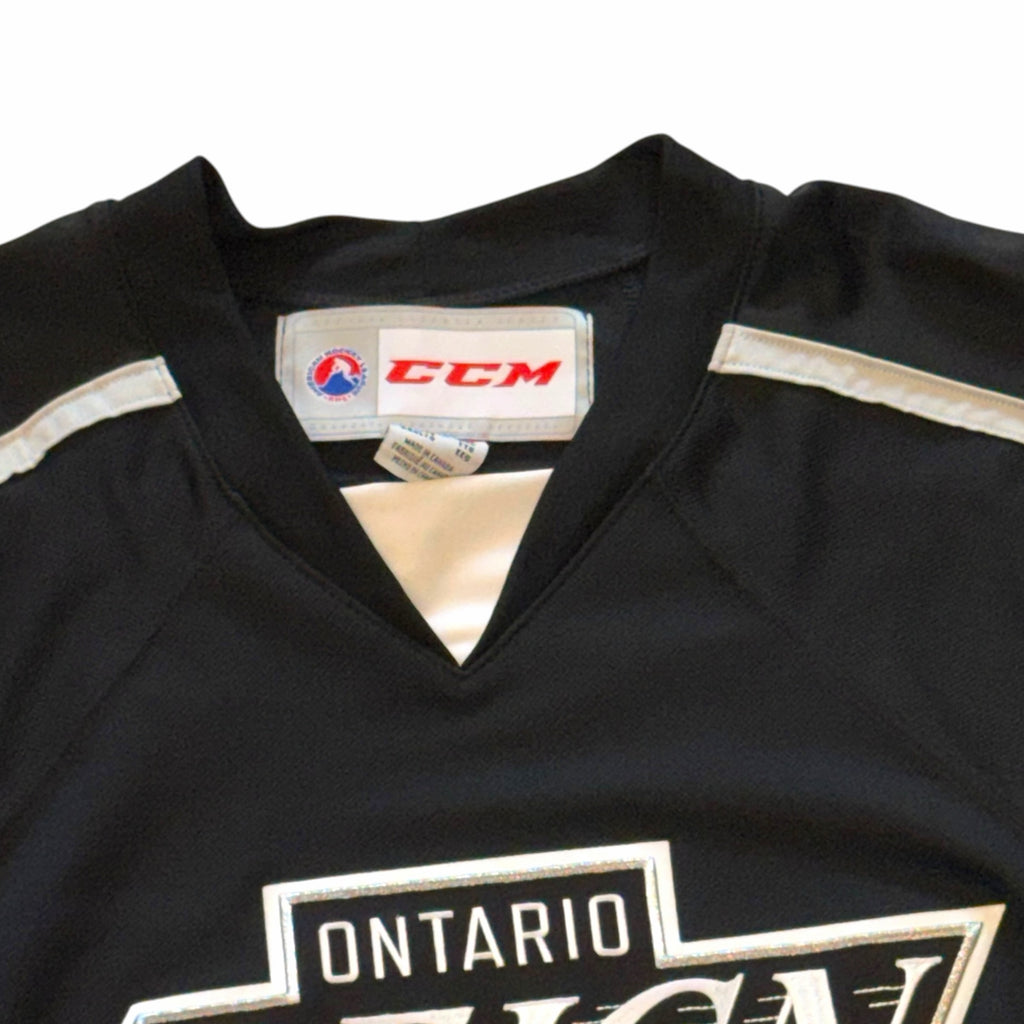 Vangsworld, Inc Ontario Reign professional hockey jersey in black with white and silver accents and CCM branding