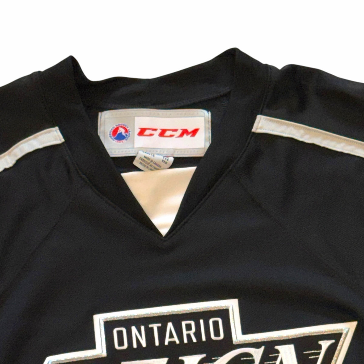 Vangsworld, Inc Ontario Reign professional hockey jersey in black with white and silver accents and CCM branding