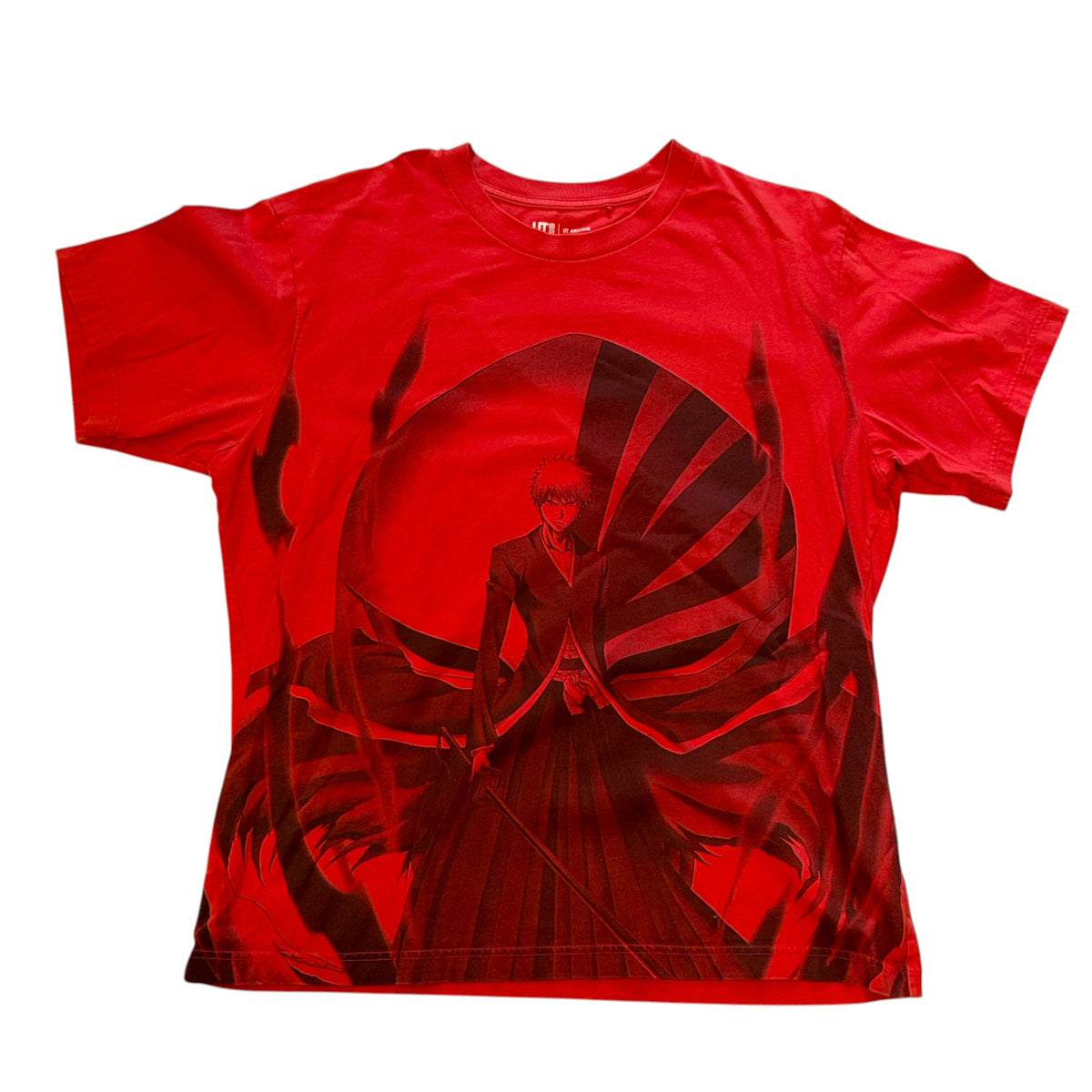Vangsworld, Inc red Bleach anime graphic t-shirt featuring Ichigo Kurosaki in a bold monochromatic print.