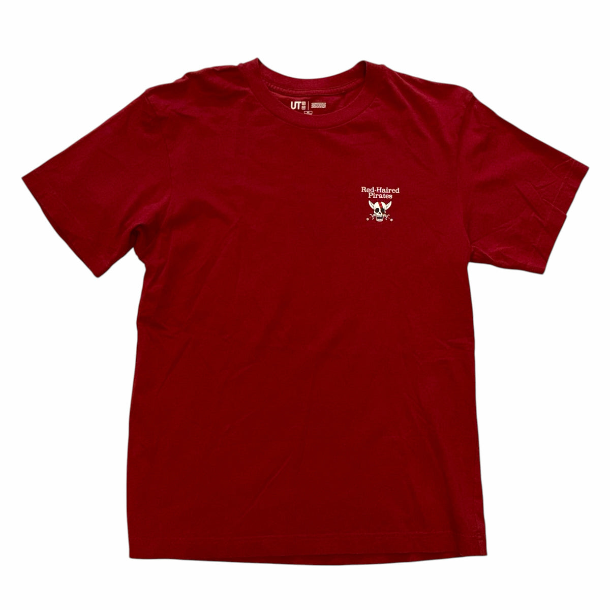 Vangsworld, Inc red cotton crew neck t-shirt with small white Red-Haired Pirates skull logo on the chest