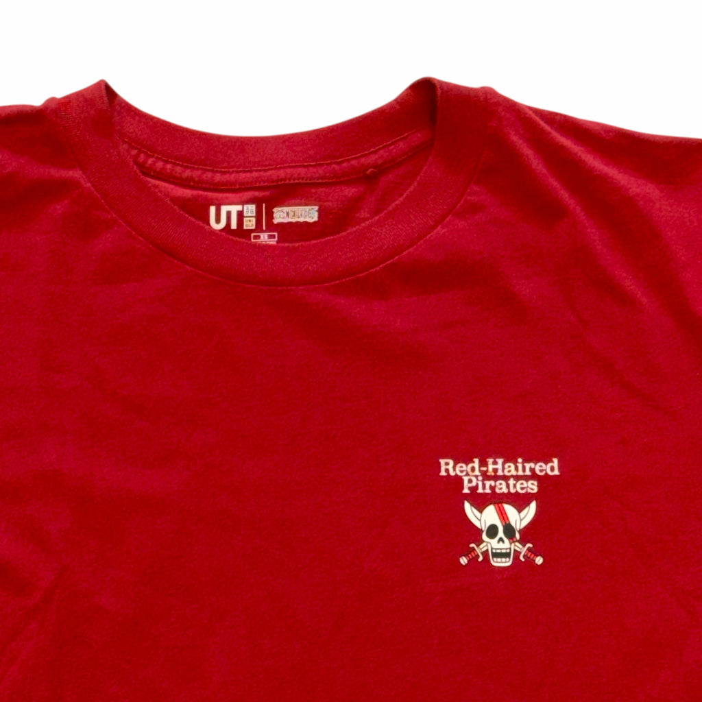 Vangsworld, Inc red cotton crew neck t-shirt featuring a small Red-Haired Pirates skull logo on the chest.