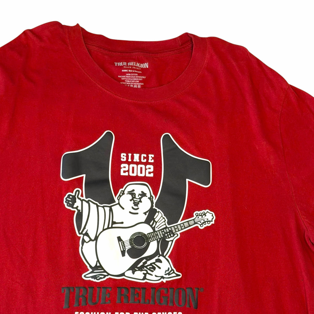 Vangsworld, Inc red cotton crewneck t-shirt featuring a True Religion Buddha graphic with a guitar and since 2002 text
