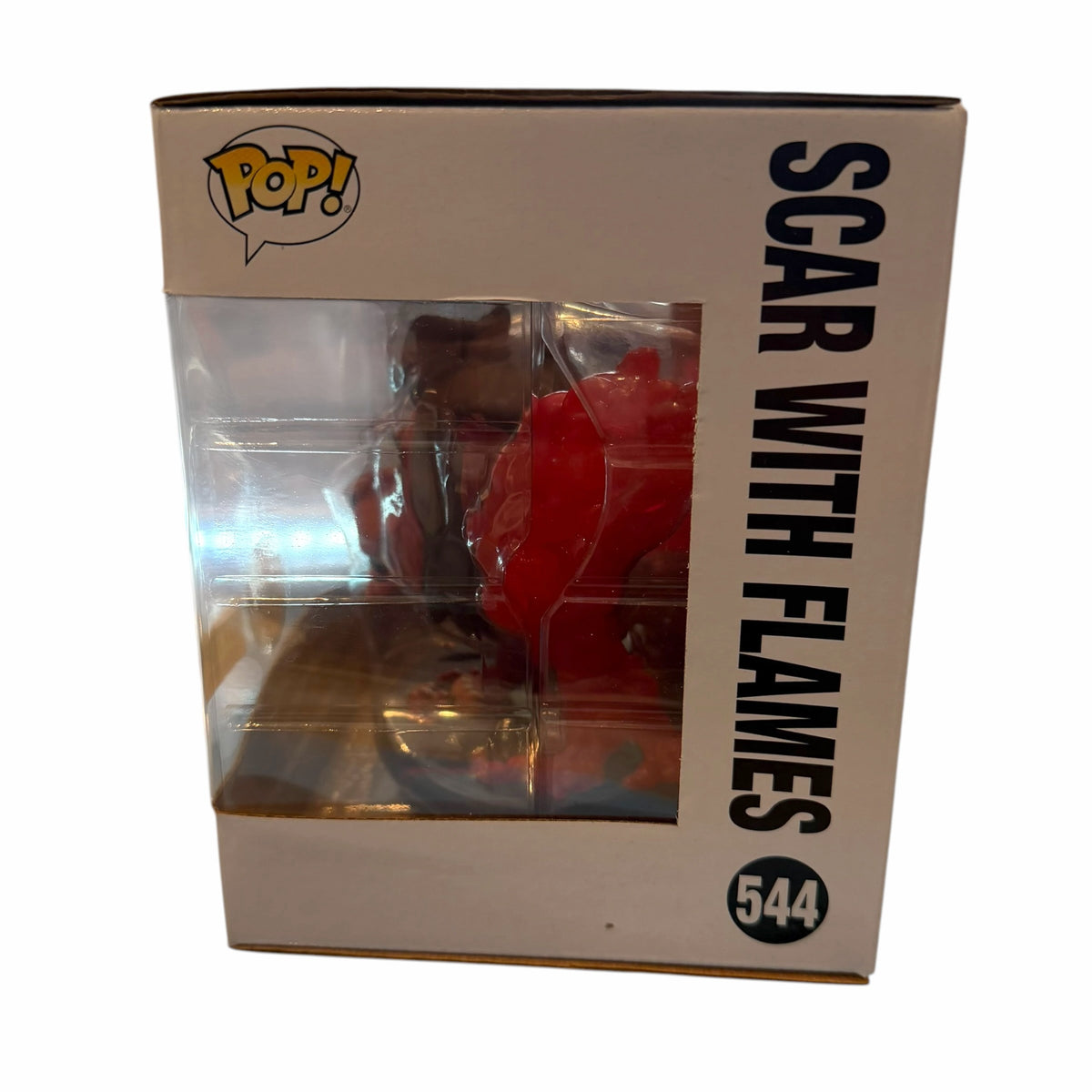 Vangsworld, Inc Funko Pop Deluxe Scar figure from The Lion King in a window display box with translucent red flames.