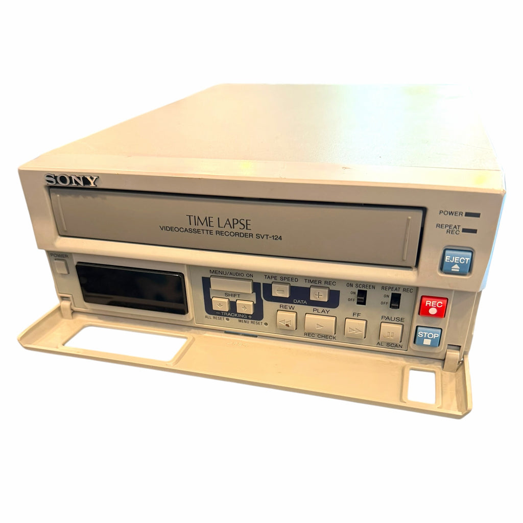 Vangsworld, Inc beige Sony SVT-124 time lapse VCR with a fold-down front control panel and analog recording buttons.