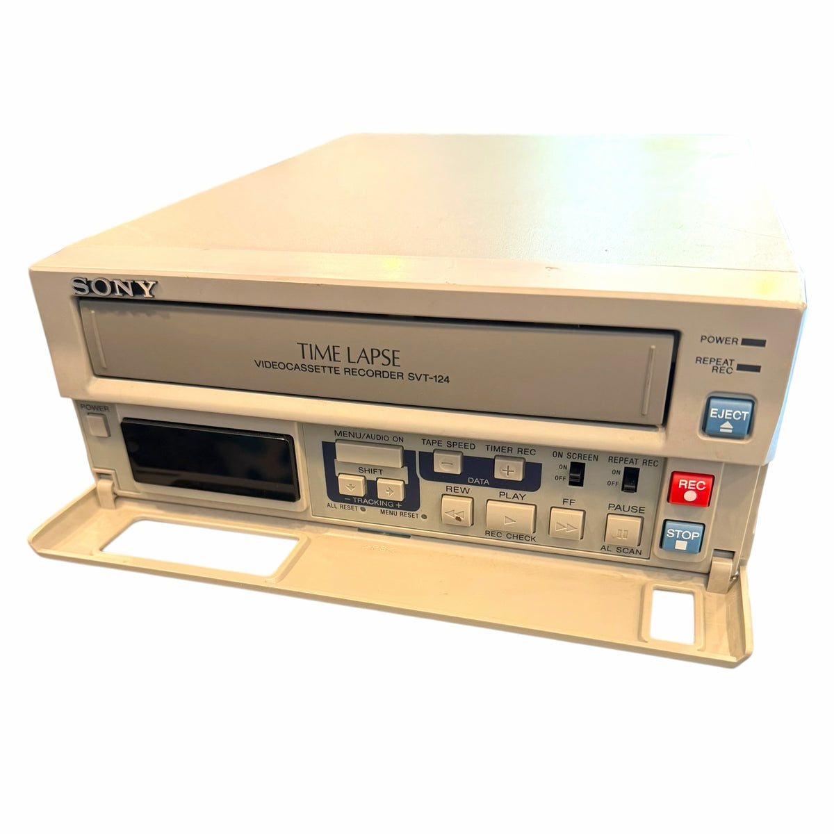 Vangsworld, Inc beige Sony SVT-124 time lapse VCR with a fold-down front control panel and analog recording buttons.