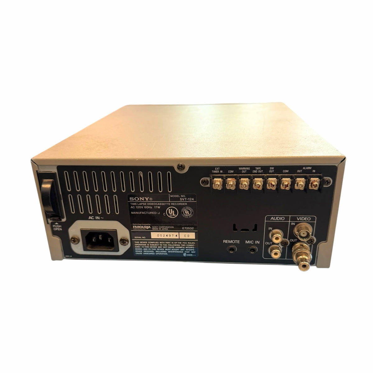 Rear view of Vangsworld, Inc Sony SVT-124 time lapse VCR showing audio, video, and alarm terminal connectivity ports.