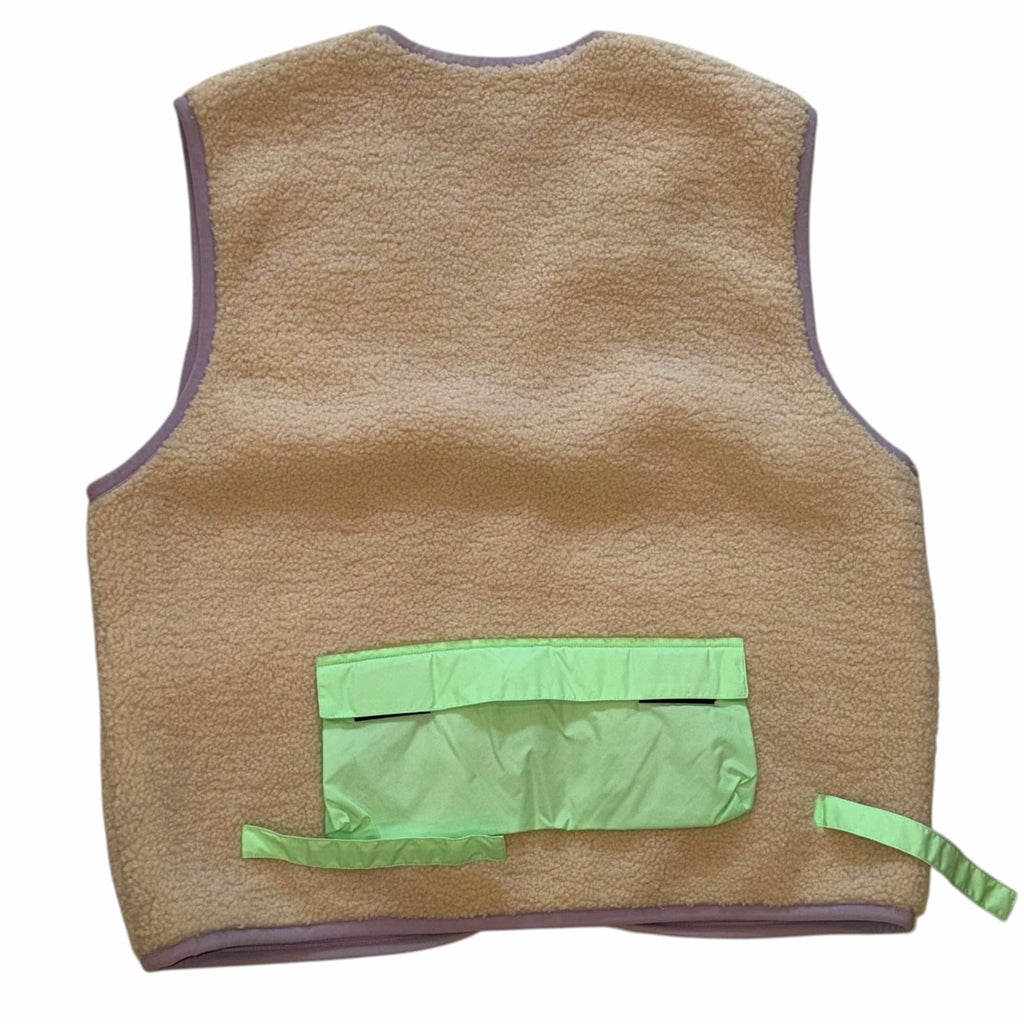 Vangsworld, Inc tan fleece utility vest with a neon green nylon back pocket and lavender trim