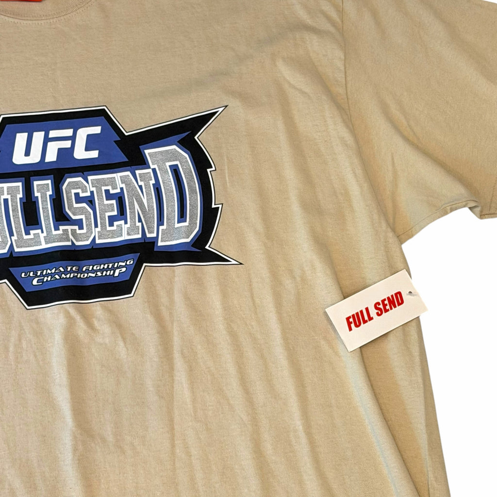 Vangsworld, Inc tan cotton crewneck t-shirt featuring a blue and silver Full Send x UFC graphic logo on the chest.