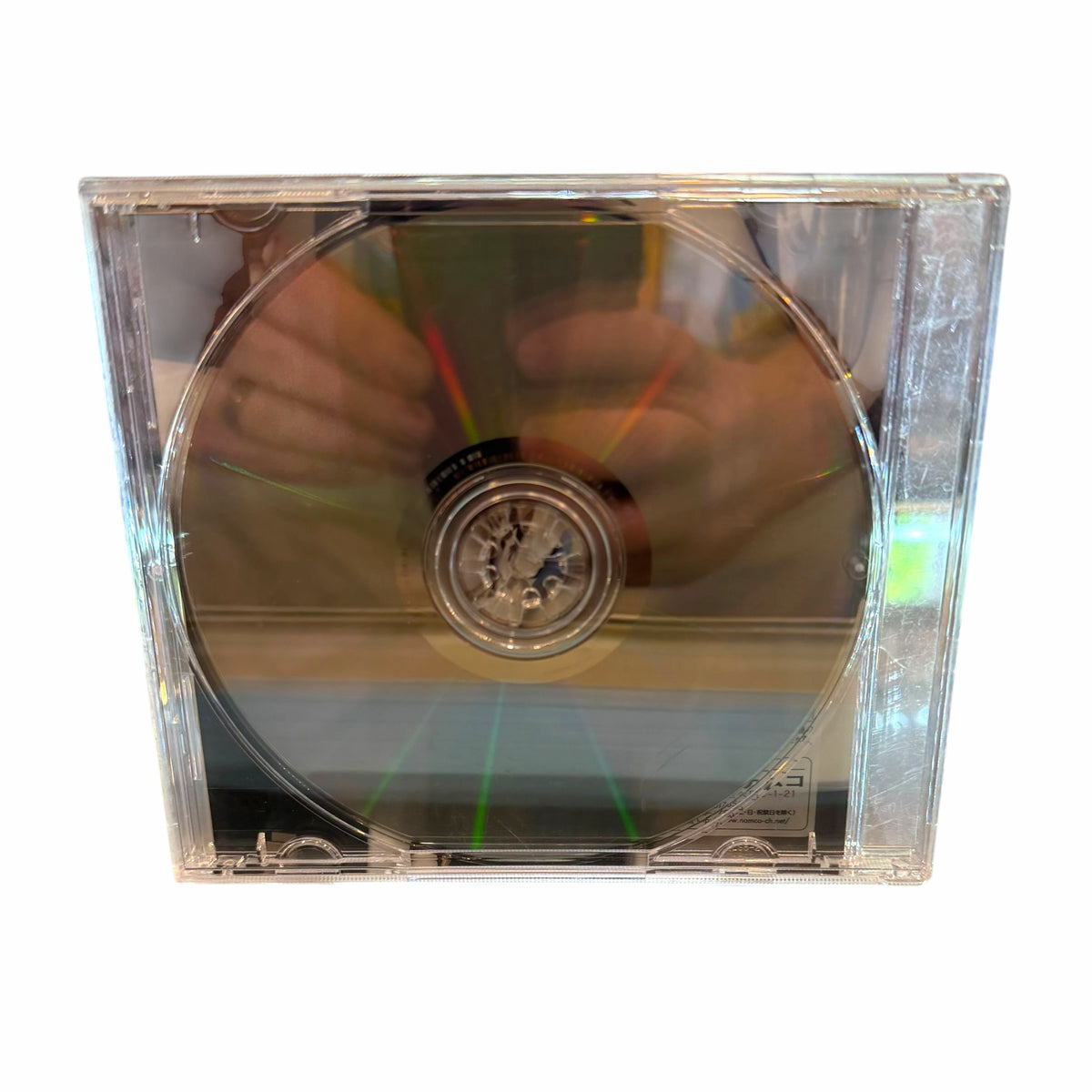 Vangsworld, Inc Xenosaga Episode II promotional DVD in a clear plastic jewel case showing the reflective disc surface.